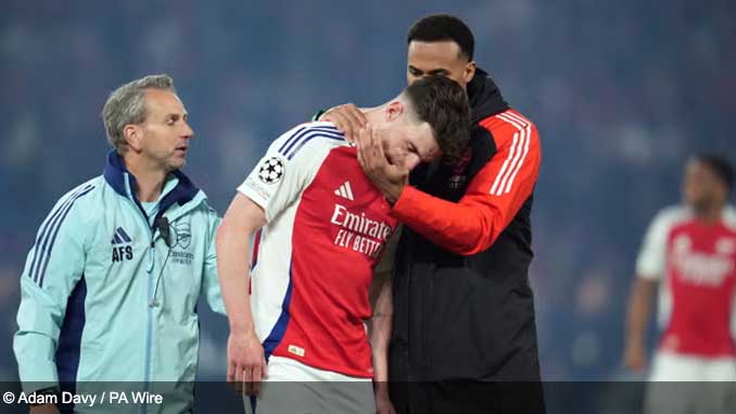 Declan Rice consoled after coming off injured against Liverpool during the Premier League 2024 Season