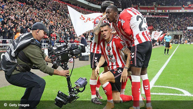 Granit Xhaka celebrates in front of the TV cameras after scoring equaliser against Everton in Premier League 2025 season